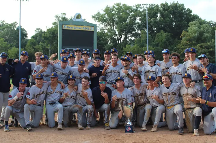 Norwich baseball team celebrating championship trophy
